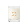 Scented candle Lilac and Driftwood in minimal glass vessel on wooden surface